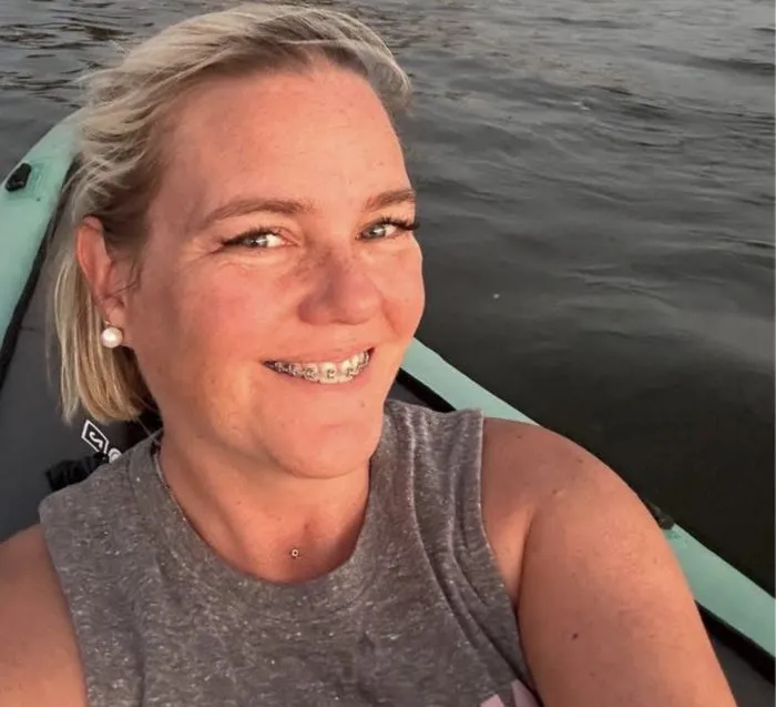 Rebecca Foret kayaking at sunset